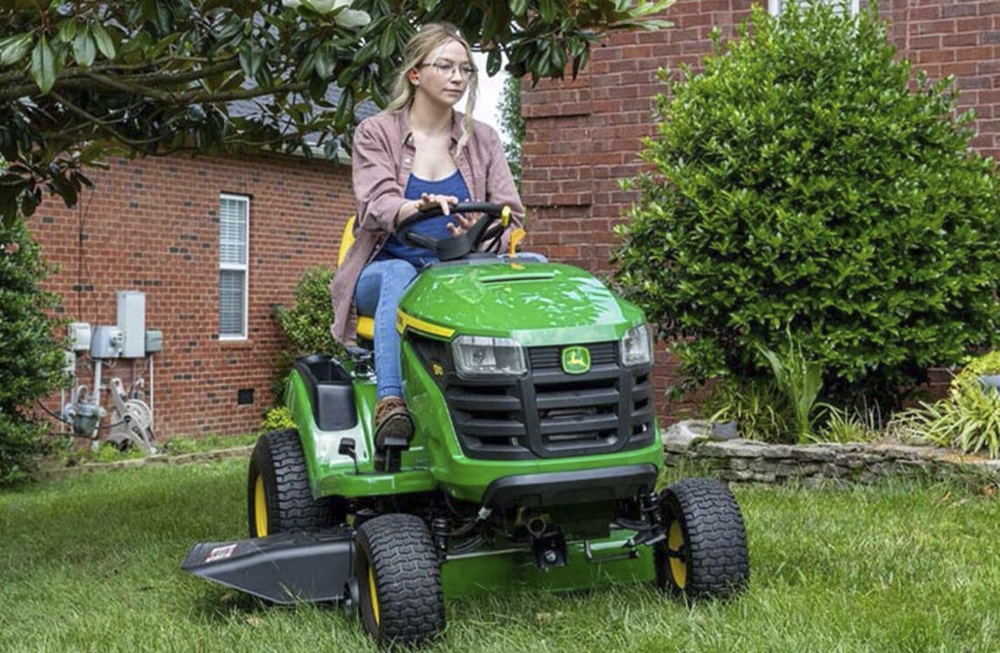 S110 Woman Mowing